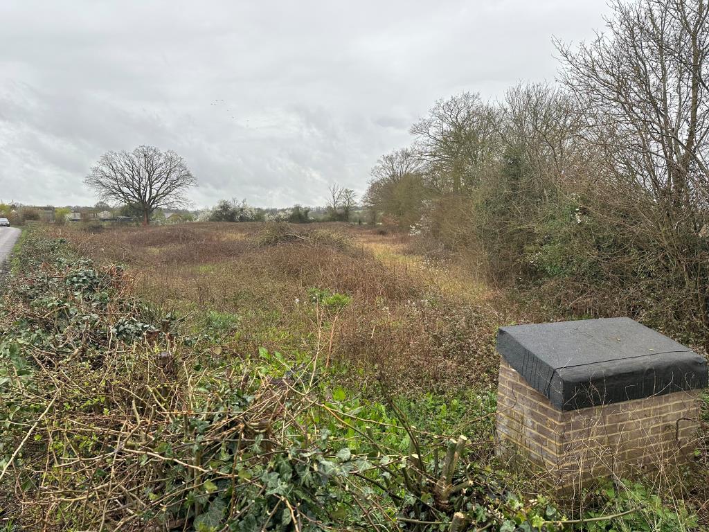 Lot: 75 - OVER ONE ACRE OF LAND WITH POTENTIAL - View of land from roadside